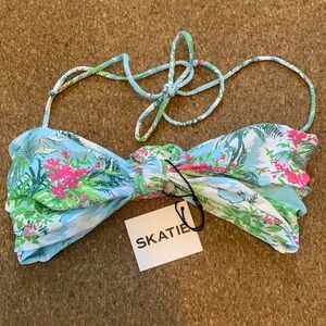 Skatie brand Lyndi top size Small. Pattern is blue with palms and flowers